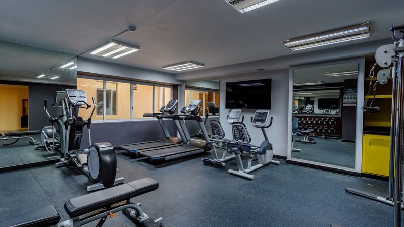 Exercise machines in a gymnasium at Gamma Hotels