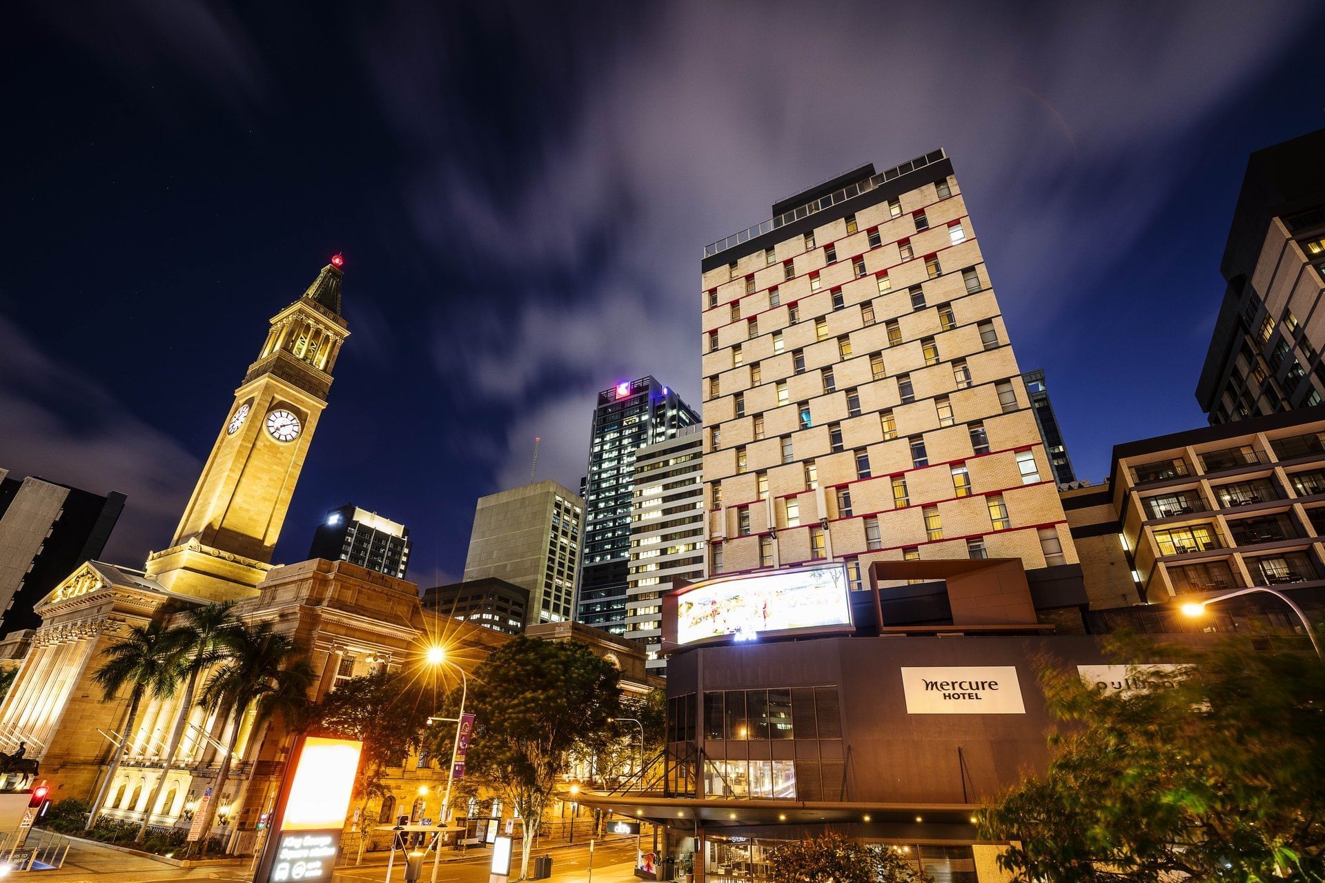 Exterior low-angle night view of the Pullman & Mercure Brisbane King George Square