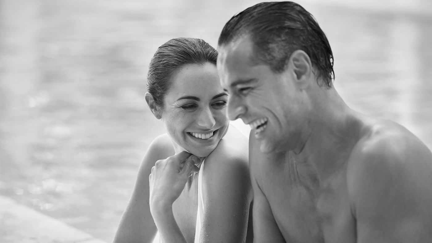 Couple enjoying time in the pool at Crown Hotels