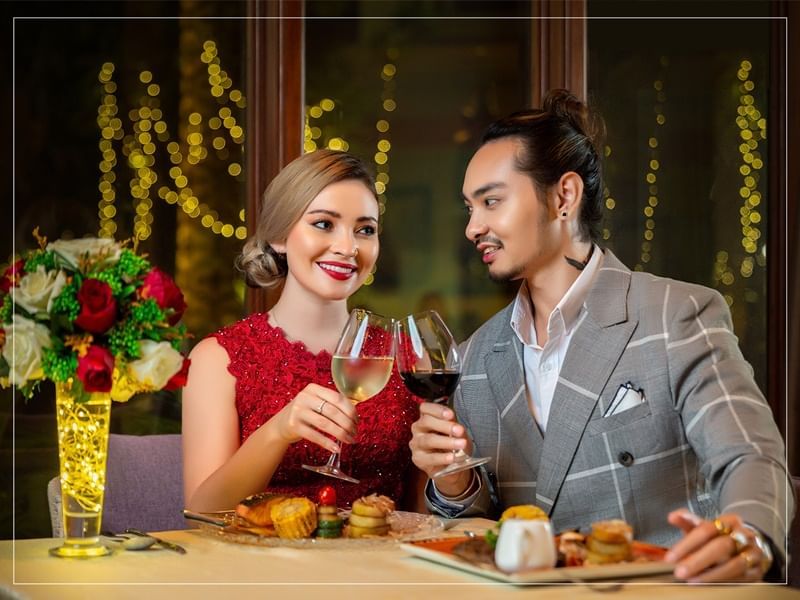 A couple enjoying dinner together at Chatrium Royal Lake Yangon
