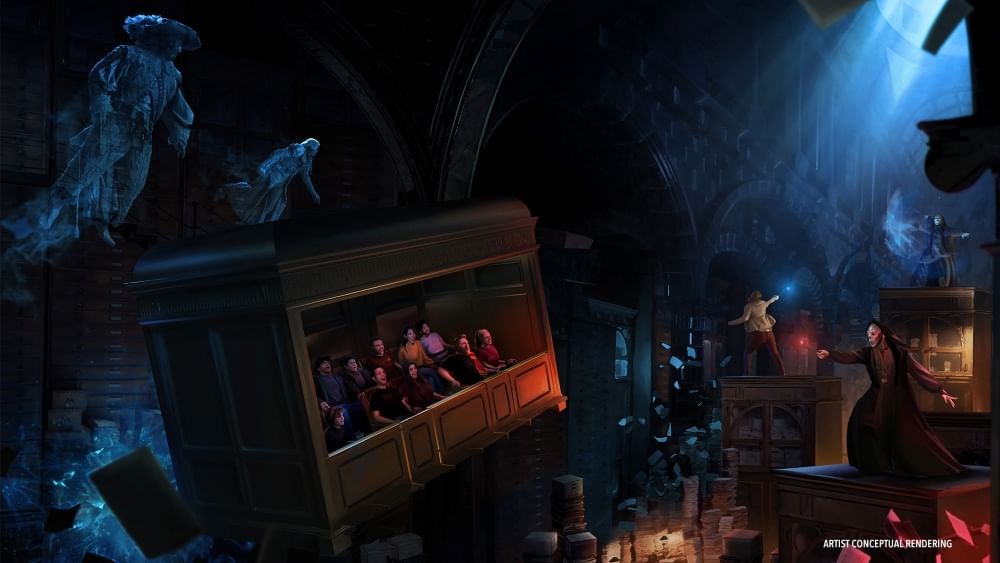 A conceptual rendering of a square box car with an open side and two rows of riders facing out, surrounded by figures in long, black wands and skull-like masks.