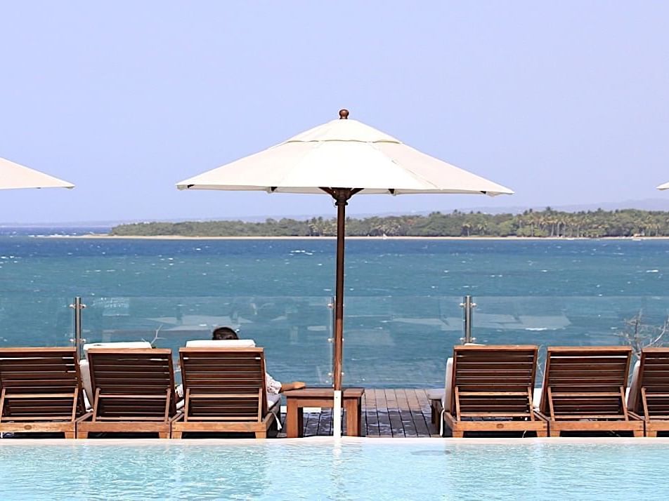 Sun Beds by the pool & beach at Casa Colonial Beach and Spa