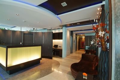 Lobby area with front desk at Amora Neoluxe Hotel Bangkok