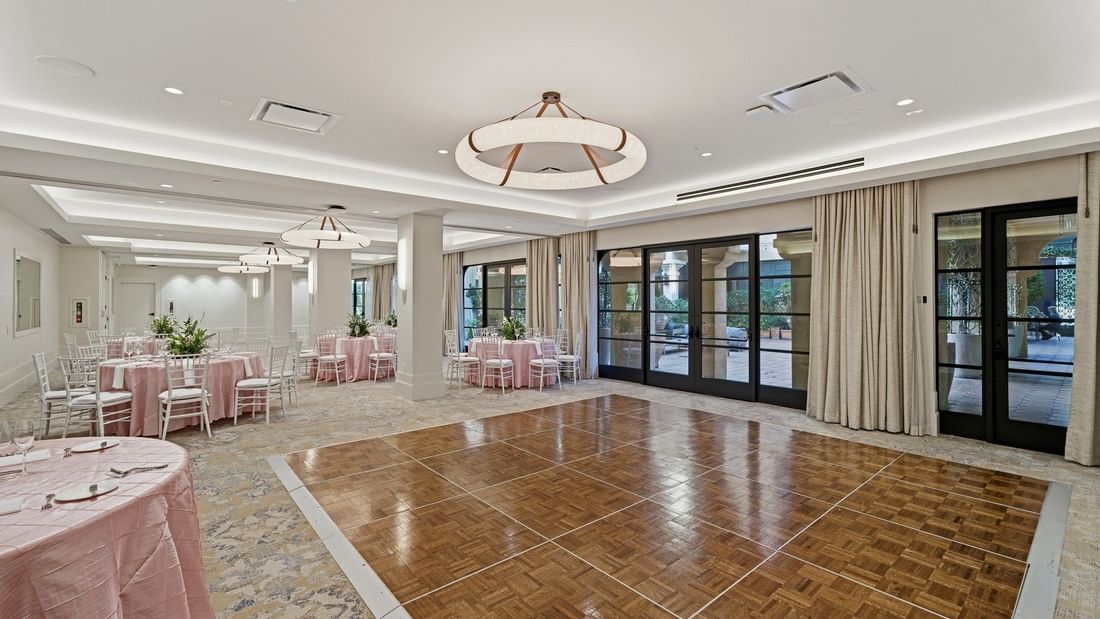 Elegant Courtyard Ballroom with tables and chairs setup at el PRADO Hotel in Palo Alto.