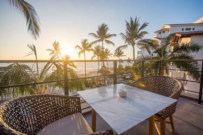 Dining table on a balcony at Buenaventura Grand Hotel