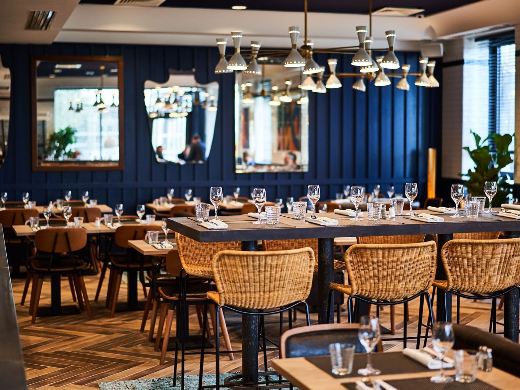 Interior of a restaurant set up for dining at Kopster Hotel