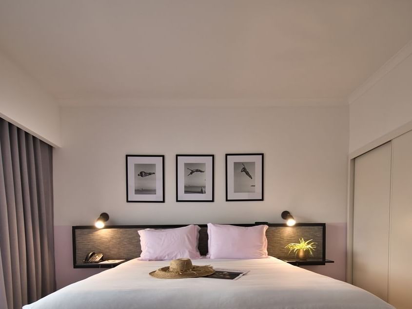 Bedroom with wall pictures - The Magnolia Hotel