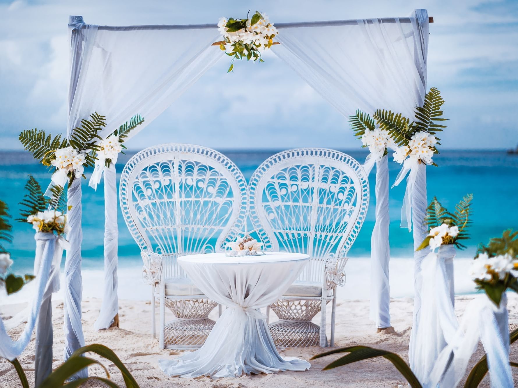 Wedding ceremony décor by the beach at Daydream Island Resort
