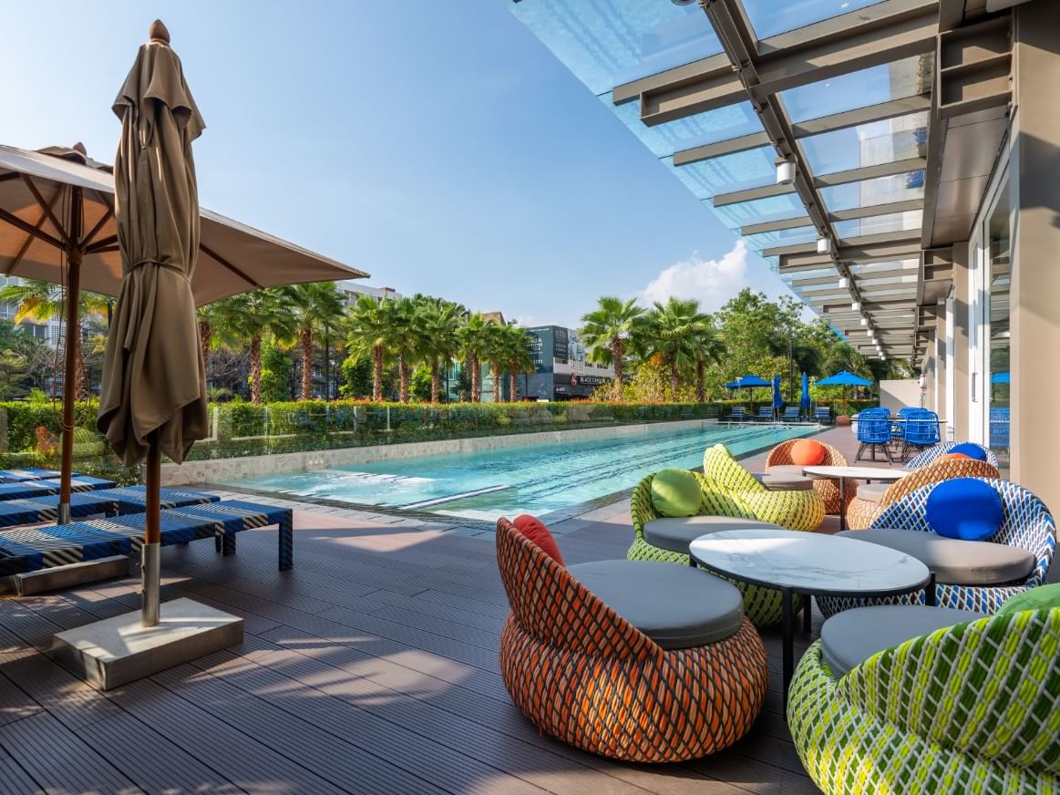 Close up on the lounges by the pool at Maitria Hotel Rama 9
