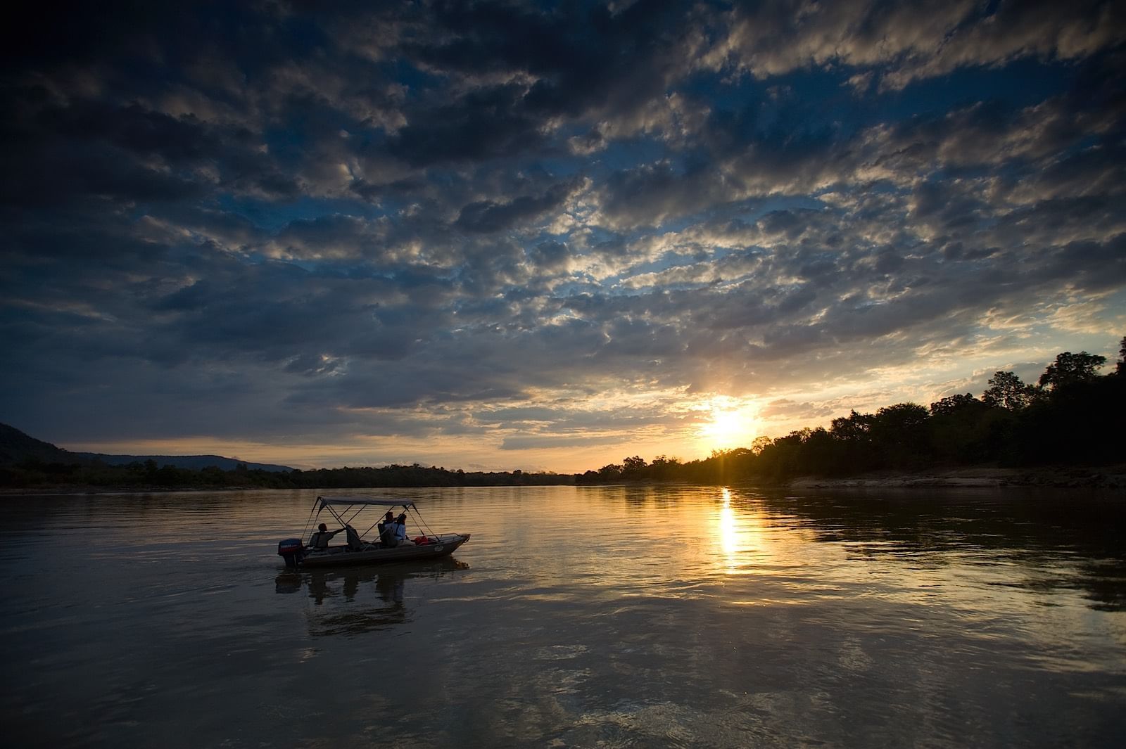 Landscape view of a boat near Serena Mivumo River Lodge