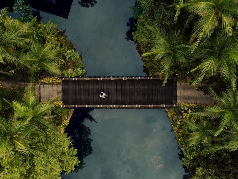Aerial view of a bridge near The Banjaran Hotsprings Retreat promoting their stay longer special package