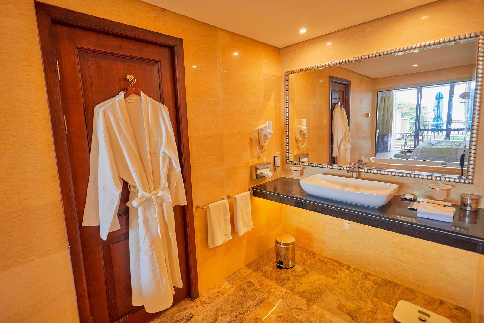 A Robe in the Superior Deluxe bathroom at Goma Serena Hotel