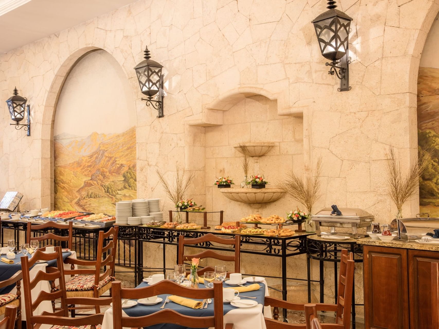 Buffet display by a dining area in a Restaurant at Gamma Hotels