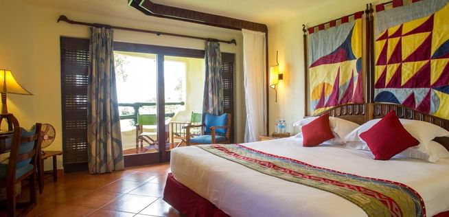 King bed in Standard Room at Lake Manyara Serena Lodge