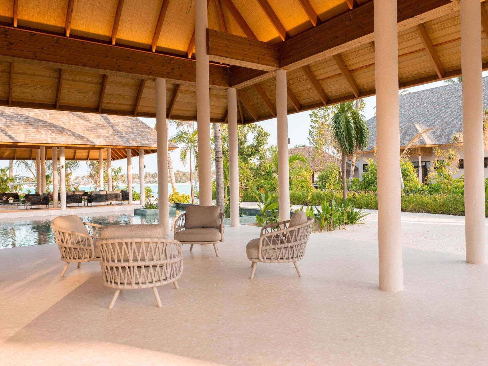 Open reception area with a lounge overlooking the sea at Ananea Madivaru Maldives