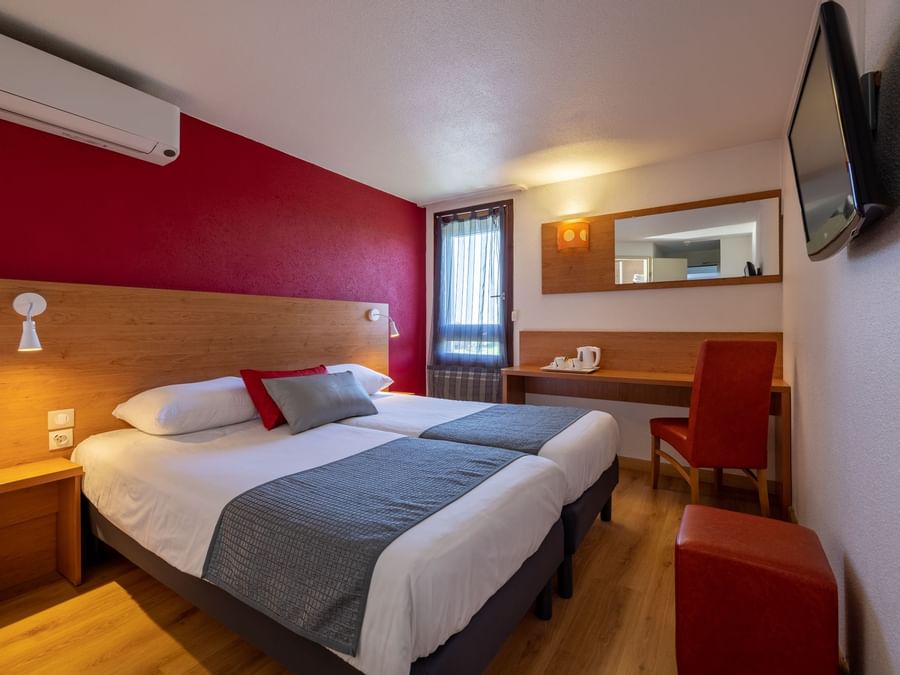 Double beds with TV in Hotel Macon Sud at The Originals Hotels