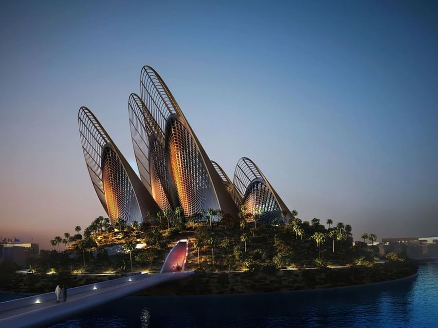 Illuminated The Zayed National Museum with a ribbed design at dusk near DAMAC Hotels & Resorts