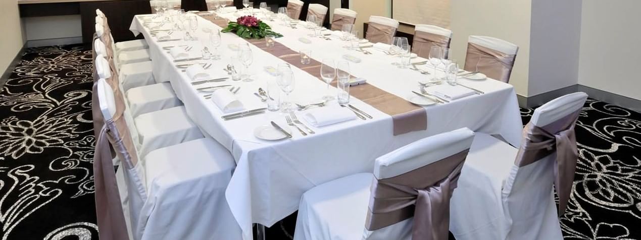 Table setup for event in Collins room at Novotel Melbourne