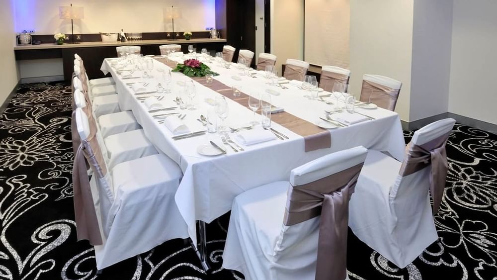 Table setup for event in Collins room at Novotel Melbourne