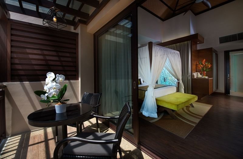 Bedroom & open lounge area in Lake Villa at The Banjaran Hotsprings Retreat