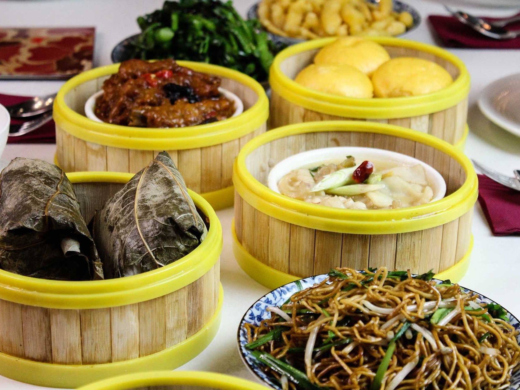 A table with multiple food items in Ming Dragon restaurant at  Encore by Mingara