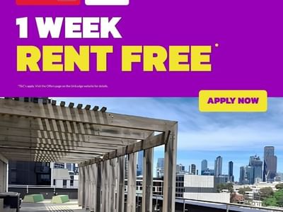 Rooftop terrace with pergola and city skyline views at Student Living on Villiers
