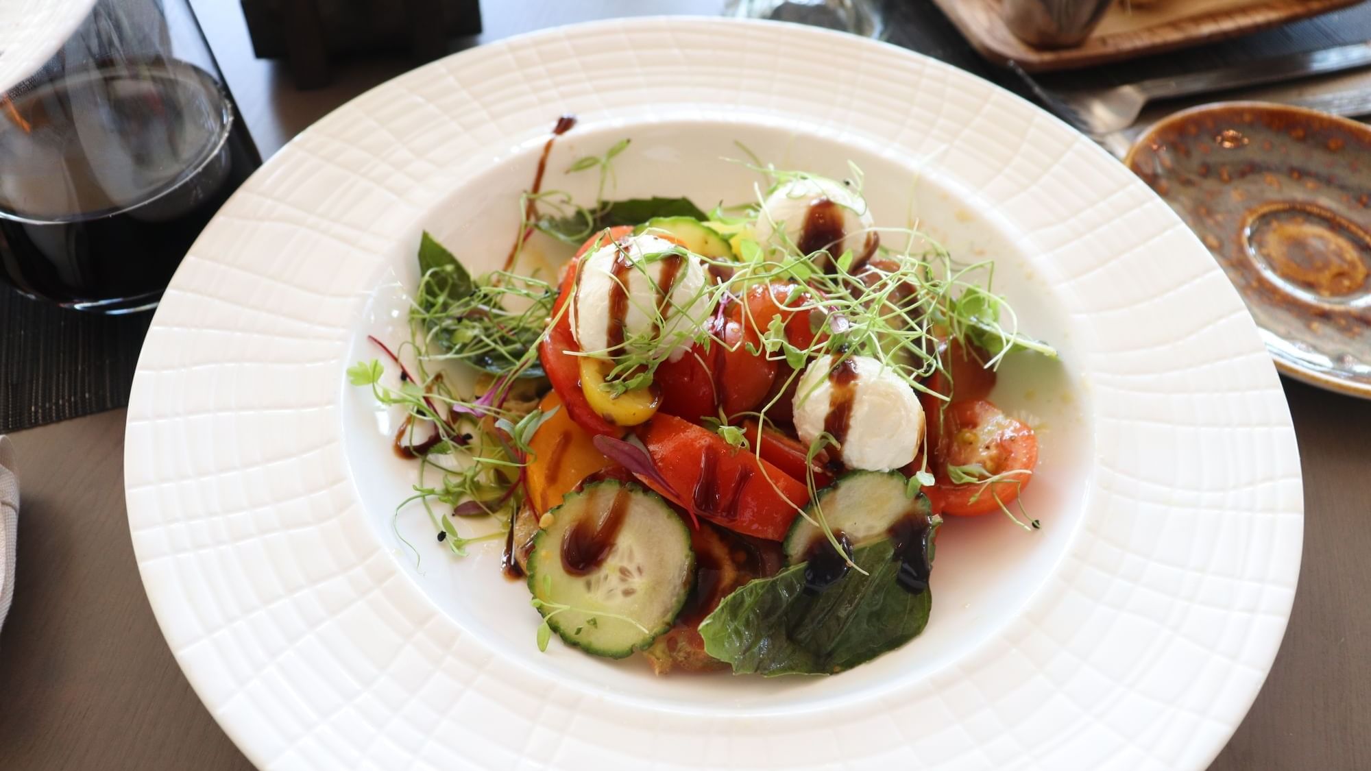 Smoked burrata served on a plate in 1936 at Camp Creek Inn