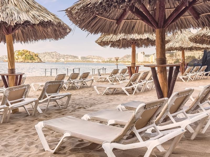 Sun loungers by the beach at FA Hotels & Resorts