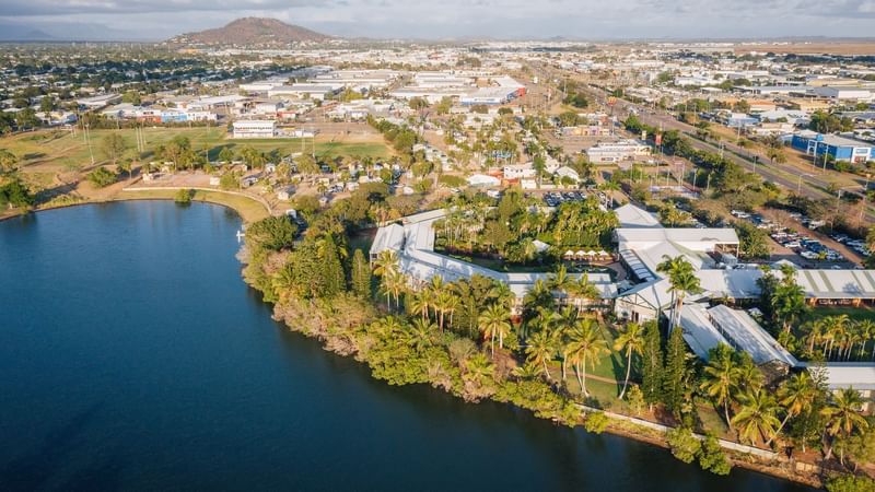 Aerial view of Townsville with lush greenery and distant hills near Mercure Hotel Townsville