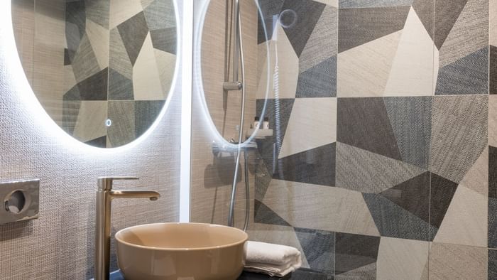 Bathroom vanity in bedrooms at Hotel Rennes South Chantepie