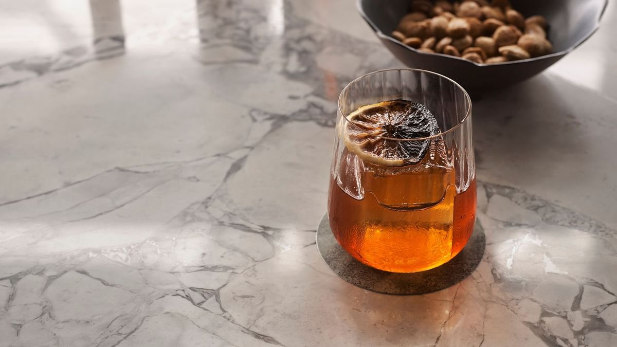 Close-up of juice glass in Woodcut at Crown Towers Sydney