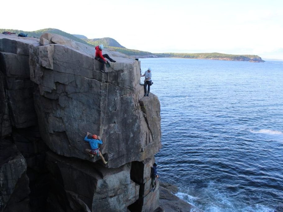 group of people rock climbing