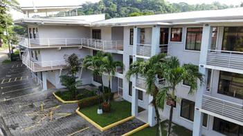 Arrecifes Apartment surrounded by palm trees and greenery at Punta Leona Beach Club & Nature Resort