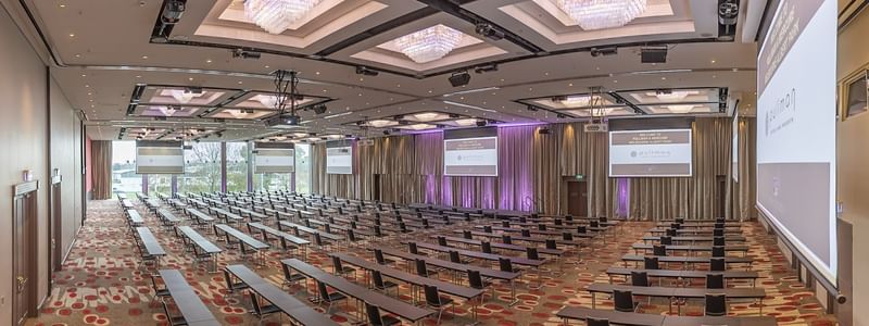 Meeting room arranged with long tables and chairs at Pullman Albert Park