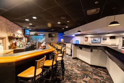 Bar counter area with stools in Twigs Bar & Lounge at M Hotel Buffalo