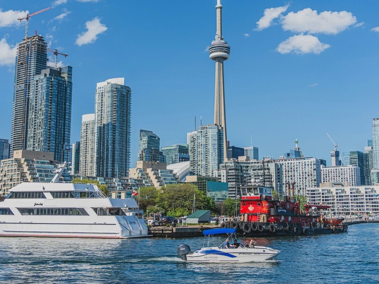 yacht and boat on toronto's waterfront, cn tower in the backgroung