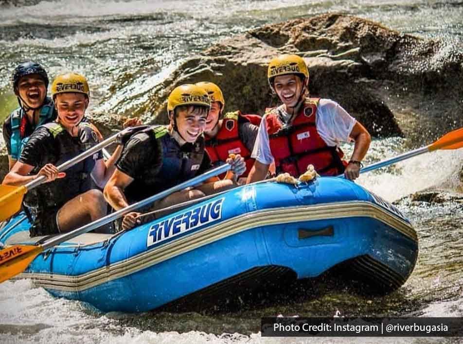 friends rafting through exhilarating waters - Lexis MY