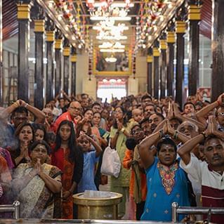 Hindus are praying in the temple in penang during thaipusam