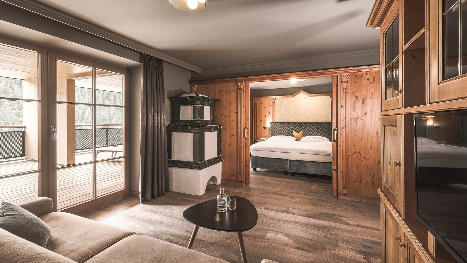 Bedroom & sofa in Romantic Suite at Falkensteiner Hotels