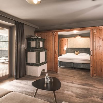 Bedroom & sofa in Romantic Suite at Falkensteiner Hotels