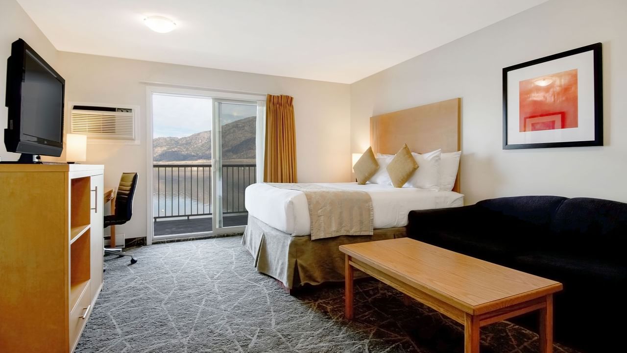 Room with a bed, view and a TV