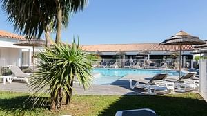 View of the outdoor pool & sunbed area at Originals Hotels