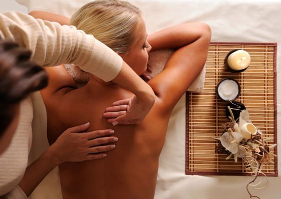 Woman having relaxing massage in the spa at Honor’s Haven Retreat