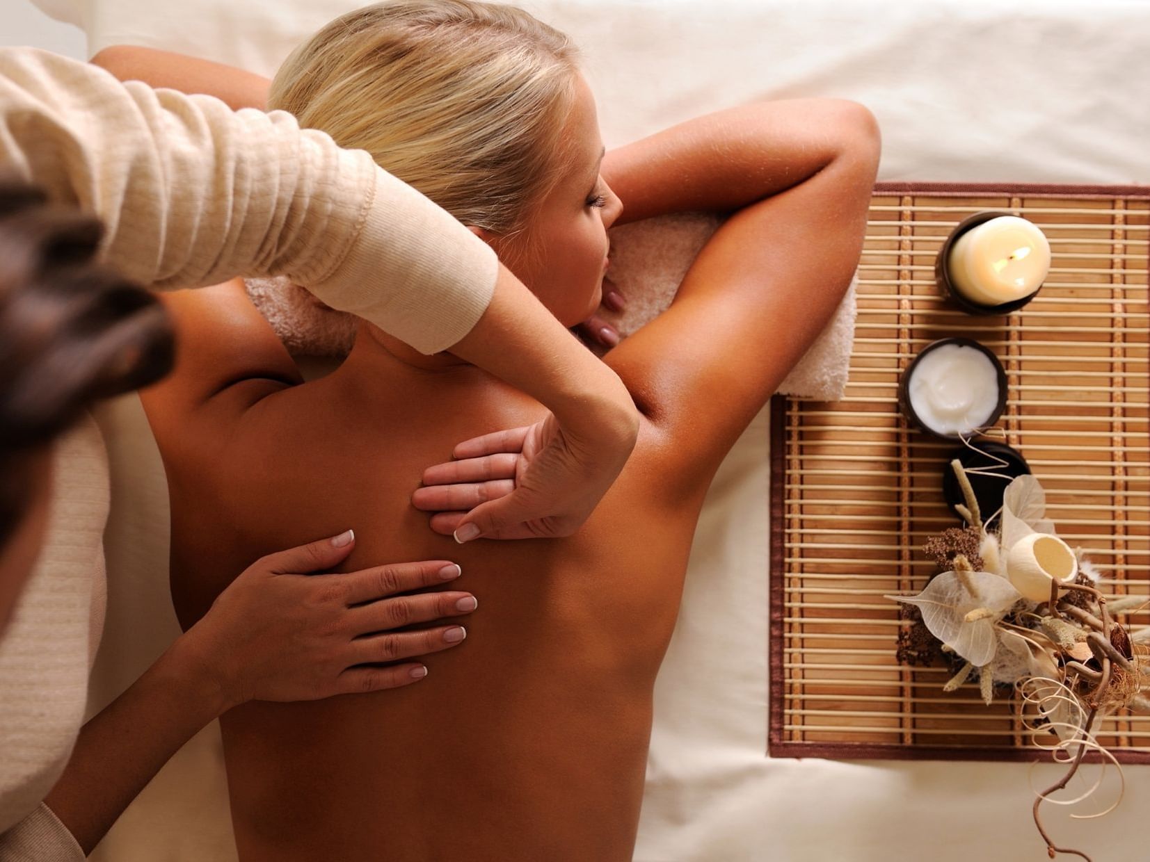 Girl having body massage in Catskills Spa at Honor’s Haven
