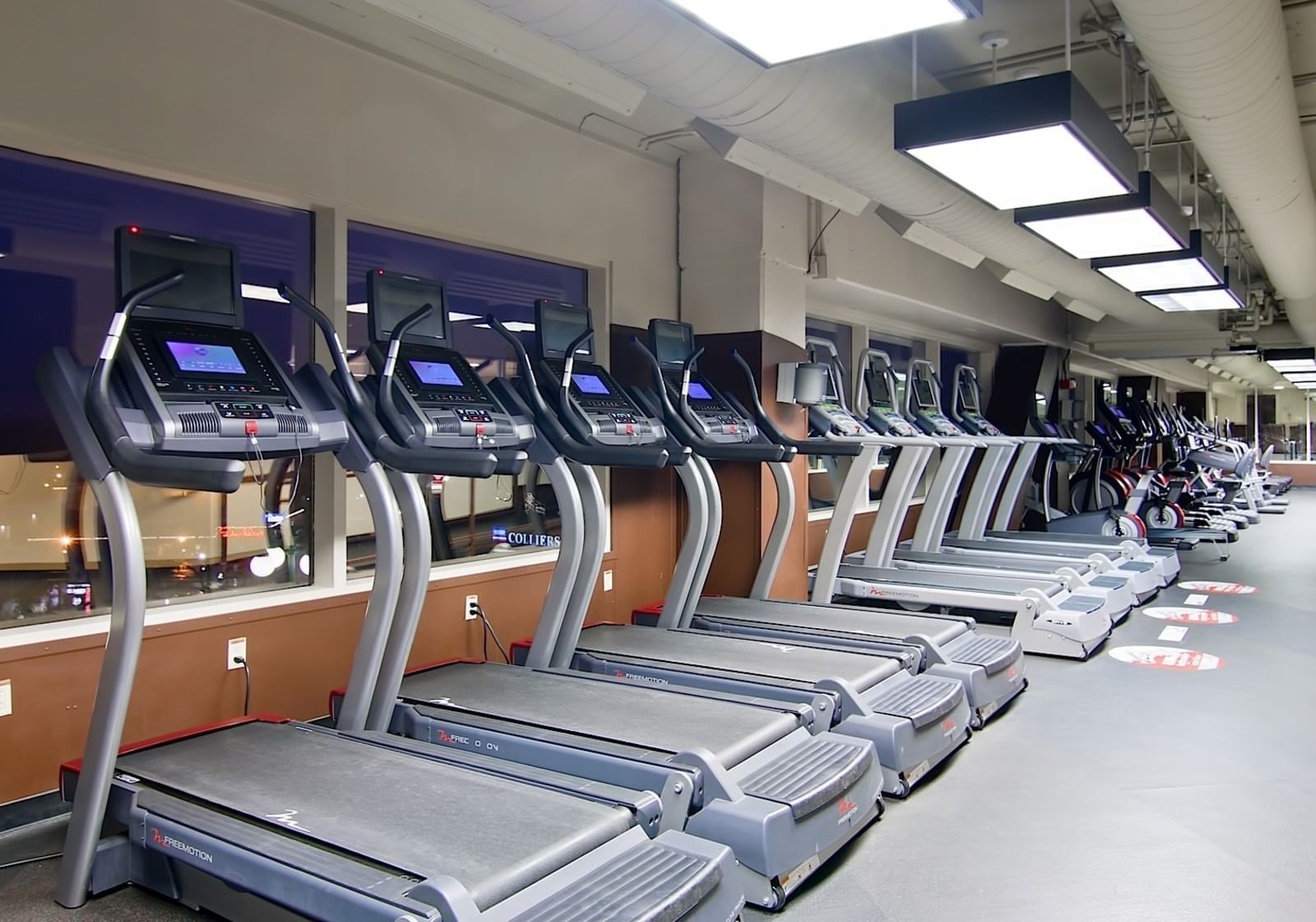 Interior of the fitness center with Treadmills at Grove Hotel