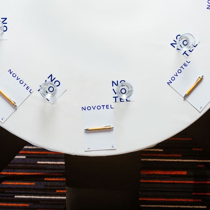 Top view of an arranged meeting table at Novotel Glen Waverley