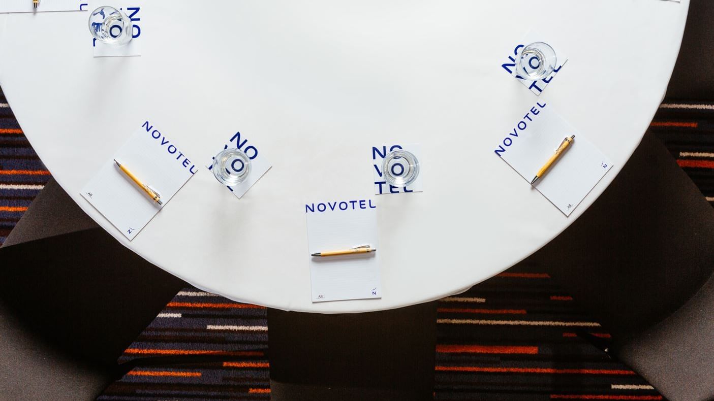 Top view of an arranged meeting table at Novotel Glen Waverley