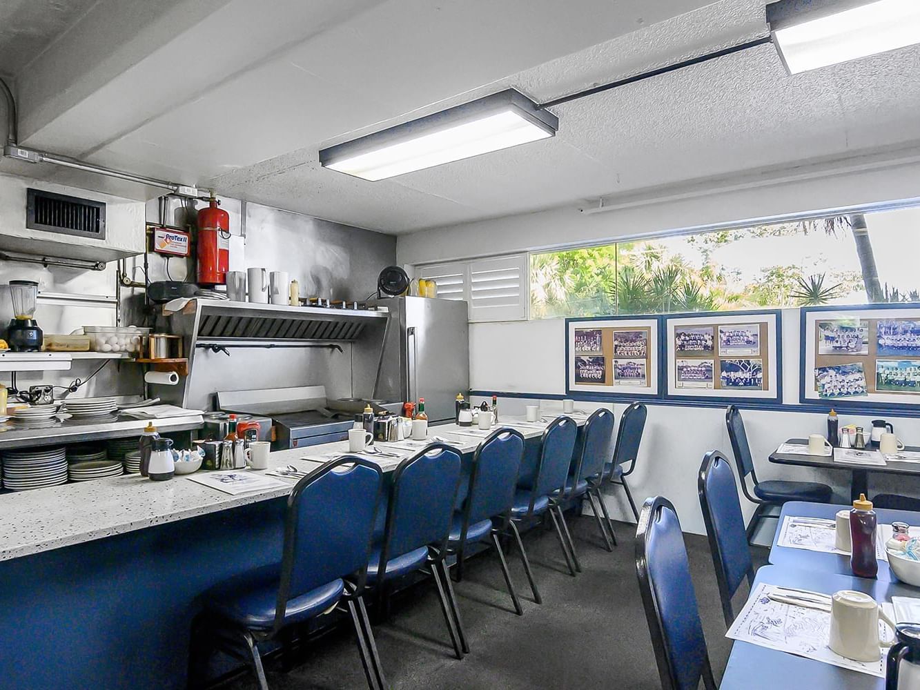 Empty restaurant with tables and chairs at Cove Inn Coffee Shoppe at Naples Bay, Naples.