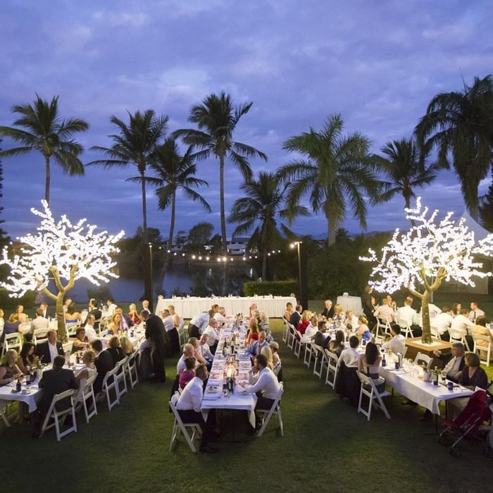 Outdoor dinner party set against a twilight sky at Mercure Hotel Townsville
