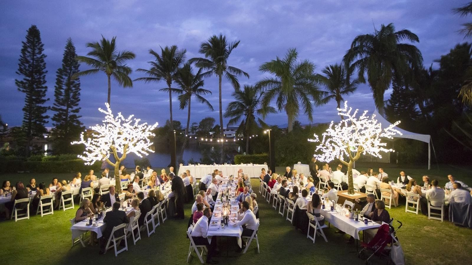Outdoor dinner party set against a twilight sky at Mercure Hotel Townsville